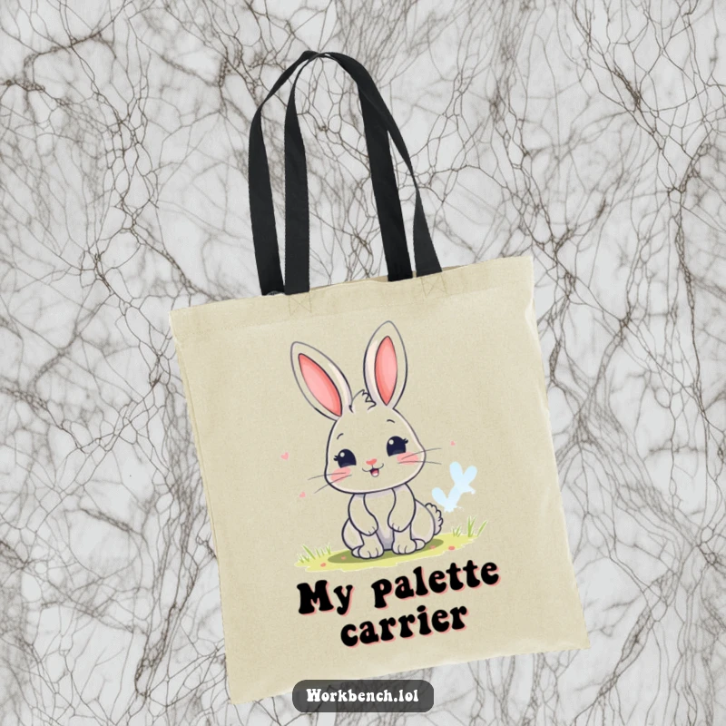 Funny bunny tote bag showing a playful character painting a colorful picture, perfect for carrying art supplies and inspiration.